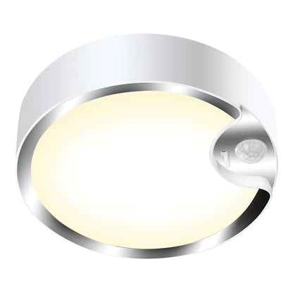 Round sensor light with a white glow on a white background