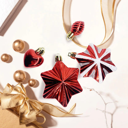 Decorative Christmas ornaments including red star-shaped and heart-shaped ones, gold bow, and a Union Jack design on a light background.