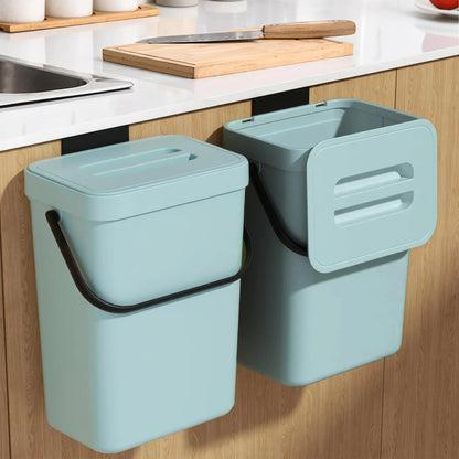 Two light blue wall-mounted trash bins in a kitchen setting.