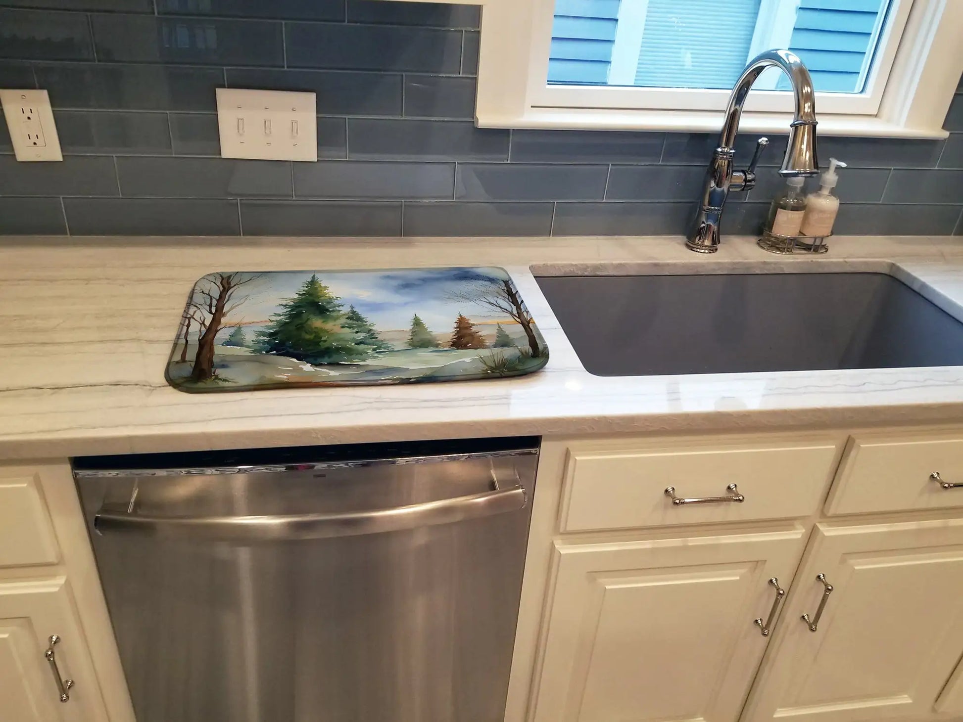 Kitchen with sink, dishwasher, and decorative mat on countertop