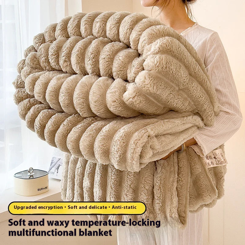 Beige multicolored blanket held by a person with product details on a light background