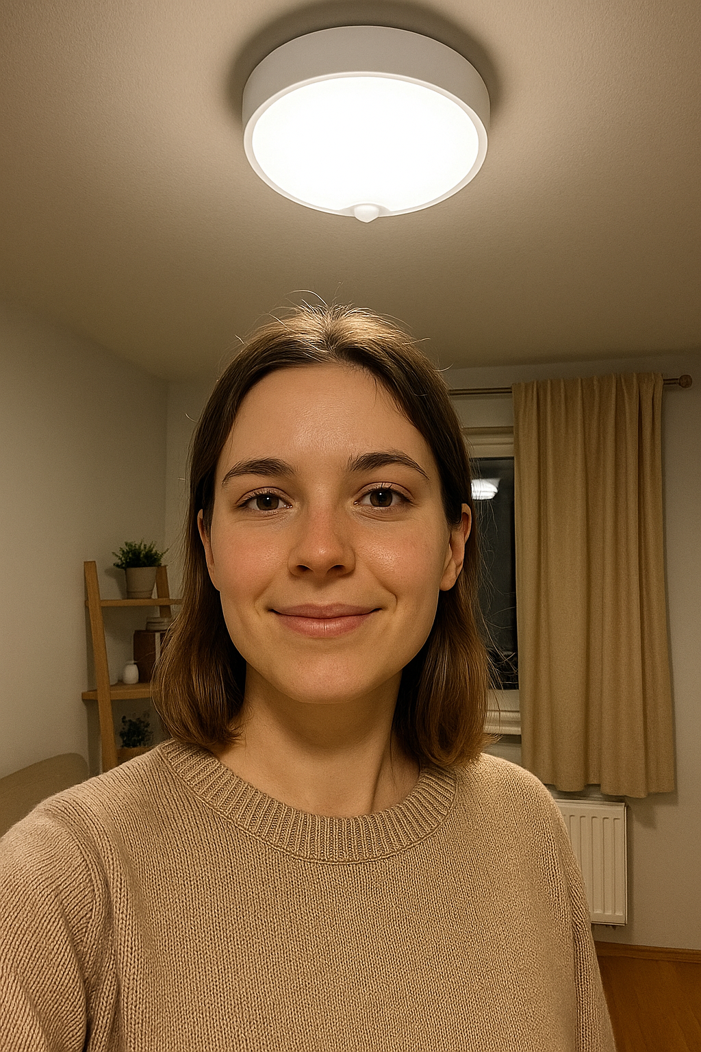 Woman smiling in a room with a light fixture on the ceiling