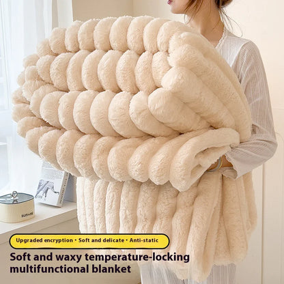 Person holding a large, fluffy beige blanket with text describing its features.