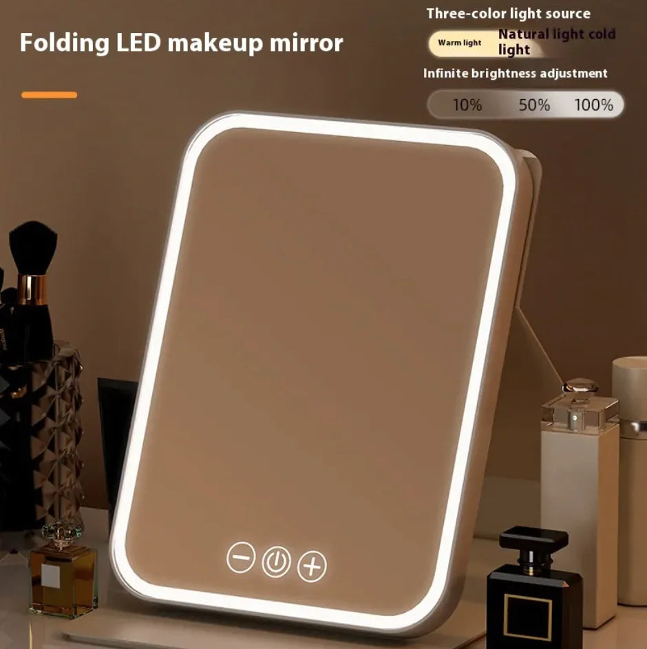 Folding LED makeup mirror with light control options on a vanity table.